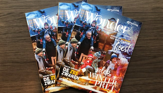 Drie exemplaren van de wintereditie van het magazine Wonder